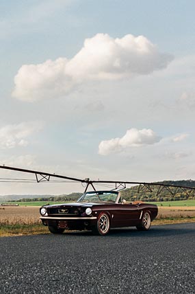 1965 Ringbrothers Ford Mustang Convertible Uncaged phone wallpaper thumbnail.