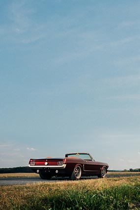 1965 Ringbrothers Ford Mustang Convertible Uncaged phone wallpaper thumbnail.